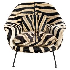 a zebra print chair with black legs