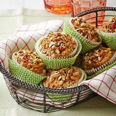 several muffins sitting in a basket on a table