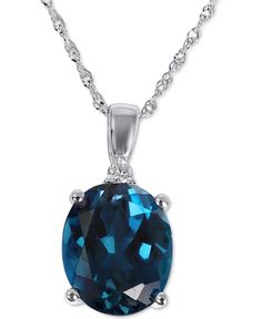 Indulge your senses with the unimaginable azure depths of this stunning London blue topaz and diamond accent pendant necklace. Macy's Oval Sterling Silver Jewelry, Macy's Blue Jewelry With Diamond Accents, Macy's Blue Diamond Accented Jewelry, Macy's Blue Diamond Accent Jewelry, Macy's Blue Fine Jewelry, Classic Blue Jewelry From Macy's, Classic Blue Macy's Jewelry, Elegant Blue Topaz Jewelry From Macy's, Blue Topaz Necklace