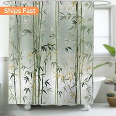 a shower curtain with bamboo leaves on it in a white bathroom next to a bathtub