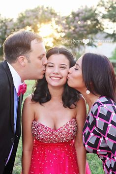 two women and a man kissing each other