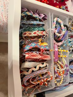 the drawer is filled with bracelets and beads