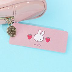 Store your hair ties and trinkets inside this super kawaii enamel pouch. It features a print of Miffy playing with strawberries! This zippered pouch has cute strawberry charm. Kawaii Rectangular Pencil Case Gift, Kawaii Pencil Case With Cute Design For Gifts, Kawaii Zipper Pouch Pencil Case Gift, Pink Kawaii Pencil Case Gift, Kawaii Rectangular Pencil Case For Gift, Kawaii Pencil Case With Zipper Pouch As Gift, Pink Kawaii Pencil Case For Gift, Cute Pouch Pencil Case For Gift, Cute Zipper Pouch Pencil Case Gift