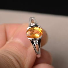 This is a gorgeous handmade creation. Its beauty is its simplicity & Elegance. The 6*8mm oval shape faceted natural citrine is crafted in solid sterling silver and with rhodium plated. All item is sent in a beautiful gift box If you have any idea of design your ring,pls contact me directly. You can realize more lovely stuff clicking the link https://www.etsy.com/shop/knightjewelry?refshopsection_shophome_leftnav Please leave the correct address and you phone number for delivering successfull Oval Citrine Birthstone Ring, Oval Yellow Citrine Birthstone Ring, Orange Oval Sapphire Gemstone Ring, Orange Oval Sapphire Ring, Oval Citrine Birthstone Ring For Anniversary, Oval Citrine Topaz Ring In White Gold, Oval Faceted Topaz Ring In Sterling Silver, Faceted Oval Topaz Ring In Sterling Silver, Oval Citrine Crystal Ring With Birthstone