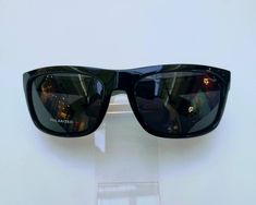 This is a High Quality  Square Black Color  Frame ( Shiny  Finish ) Black  Lens  Sunglasses. Polarized Lens will give your Eyes Extra protection whenever Sun comes on your Face. It is very good for Driving , Fishing , playing outdoor Sports or Walking . Very good for person whose Eyes are sensitive to Sun Light. Especially Driving in the Morning And Evening Facing Sun. Quality of this polarized  sunglasses is Excellent. Lens Width: 70 mm Lens Height: 50 mm Frame Width: 150 mm Temple Arm Length: Color Frame, Sunglasses Polarized, Frame Arms, Sun Light, Color Lenses, Full Frame, Eye Protection, Cool Eyes, Polarized Sunglasses