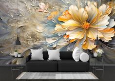 a living room scene with a couch and large flower wall mural