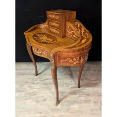 an old wooden desk with intricate carvings on it