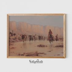 a painting of cowboys on horses in the desert