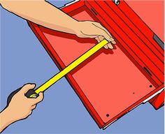 a person holding a pencil in front of a red box