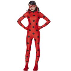 a woman in a red and black polka dot costume with her hands on her hips