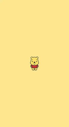 winnie the pooh wallpaper in yellow with red bow on it's head