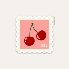 a postage stamp with two cherries on the front and one cherry on the back