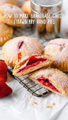 strawberry hand pies on a cooling rack with strawberries