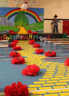 some red pom poms are on the floor in front of a basketball court