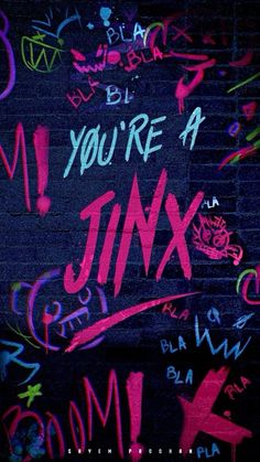 graffiti written on the side of a brick wall in pink and blue, says you're a junk