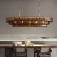 a chandelier hanging over a dining room table