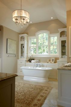 a large bathroom with a claw foot tub