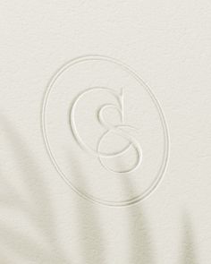 the letter g is inscribed in white paper