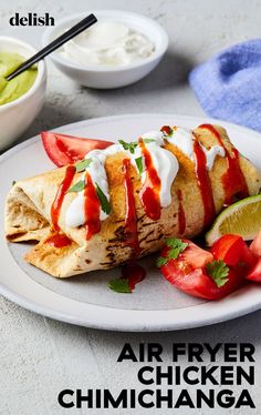 an air fryer chicken omelet with strawberries and limes on the side