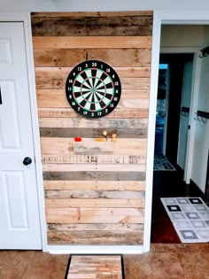 a dart board mounted to the side of a door