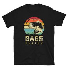 a black t - shirt with the words bass whisperer on it and a fish