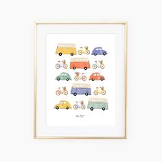 an art print with cars and bicycles in different colors on the front, behind a gold frame