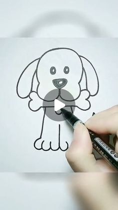 someone is drawing a dog with a marker