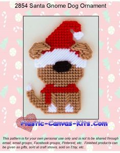 a crocheted christmas ornament with a dog wearing a santa hat