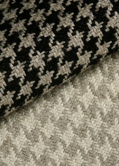 closeup of black, white and grey fabric with small crosses on the top right side