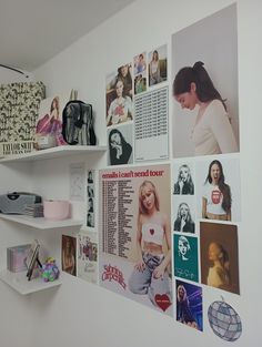 there are many pictures on the wall and shelving in this room that is decorated with photos