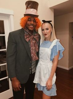 a man and woman dressed up in costumes