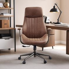 an office chair sitting in front of a desk with a lamp on top of it