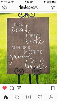 a sign that says pick a seat either side you're loved by both the groom and bride