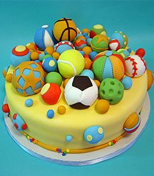 a cake decorated with balls and other items