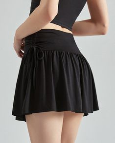 Our French Sun Tennis Skirt is a comfortable Black Mini Tennis Skirt made from lightweight, soft material that allows unrestricted movement. It is adorned with cute bows at the waist, giving it a relaxed and classy look during your tennis matches Color: Black Decorative bows at the waist Built-in shorts Size:• S: Waist: 62cm/ 24.4 in, Hips: 90cm/ 35.4 in, Length: 35cm/ 13.8 in• M: Waist: 66cm/ 26.0 in, Hips: 100cm/ 39.4 in, Length: 36cm/ 14.2 in• L: Waist: 70cm/ 27.5 in, Hips: 110cm/ 43.3 in, Le High Waist Tennis Skirt With Elastic Waistband, Solid Color Stretch Tiered Tennis Skirt, High Waist Solid Color Flowy Skort, Casual High Waist Pleated Swim Skirt, Black Flared Mini Skirt With Elastic Waistband, Summer Black Mini Skirt With Wide Waistband, Summer Black Mini Skirt With Drawstring, Black Mini Skirt With Wide Waistband For Summer, Black Casual Tennis Skirt With Wide Waistband