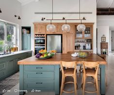 a large kitchen with an island in the middle