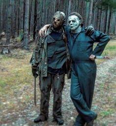 two people dressed as zombies in the woods