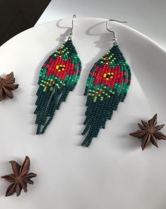 MORE DETAILS * Materials used: Czech seed beads, nylon thread, stainless steel 316 * Earrings length: ~ 10.5 cm | ~ 4.1 inches * Drop length: ~ 9 cm | ~ 3.5 inches * Earrings width: ~ 3 cm | ~ 1.2 inches * Earrings weight (both): ~ 10 grams, lightweight ! Please note that the design of this item is my own creation and copyright of MilasShopHandmade, protected by Italian Law no. 633, and any copying is forbidden About keeping shape Handwoven beaded earrings may occasionally roll up while wearing, Handmade Red Beads For Christmas, Handmade Red Christmas Beads, Handmade Bohemian Beaded Earrings For Christmas, Bohemian Handmade Beaded Christmas Earrings, Handmade Green Beaded Christmas Earrings, Handmade Green Beaded Earrings For Holiday, Handmade Green Beaded Earrings For Christmas, Holiday Green Handmade Beaded Earrings, Ivy Tree