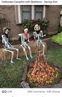 three skeletons sitting on hay bales in front of a house