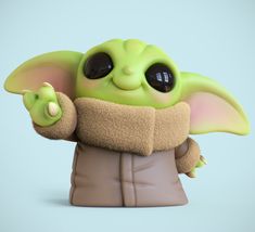 the baby yoda doll is wearing a brown coat and black eyes, holding his arm up