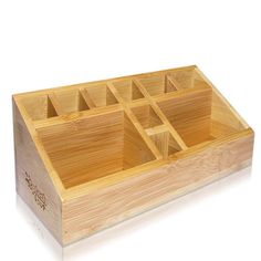 a wooden box that has compartments in it