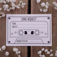 a song request for someone to play on their old radio cassette recorder with white flowers in the background