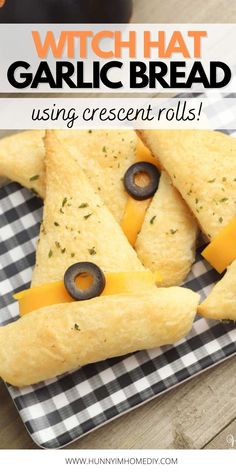 some food is on a plate with cheese and olives in the shape of eyes