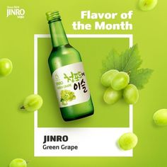 a bottle of jalapeno juice next to some grapes on a green background