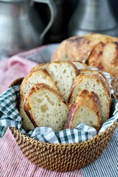 several pieces of bread in a basket on a table