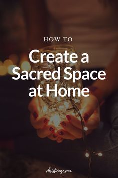 a person holding a jar with lights in it and the words how to create a sacred space at home