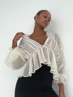 Feminine and versatile this gauze-y top features a billowy silhouette, semi-sheer fabric caption, and v-neckline. Sheer Fabric, Sheer Fabrics, Fashion Sense, Cambridge, Fabric Care, Heather Grey, Fitness Models, Sense, Outfit Inspo