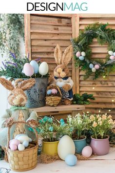 an easter display with bunnies, eggs and plants