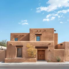 an adobe - style house in the desert is shown