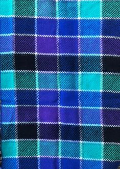 the blue and green plaid fabric is close up